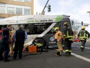 Police, firefighters and paramedics respond to a fatal accident involving a pedestrian and a C-Tran bus at the intersection of 8th Street and Washington Street in downtown Vancouver.