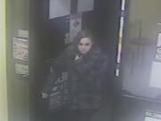 Officials released this photo of a woman who allegedly robbed a Dominos Pizza store.