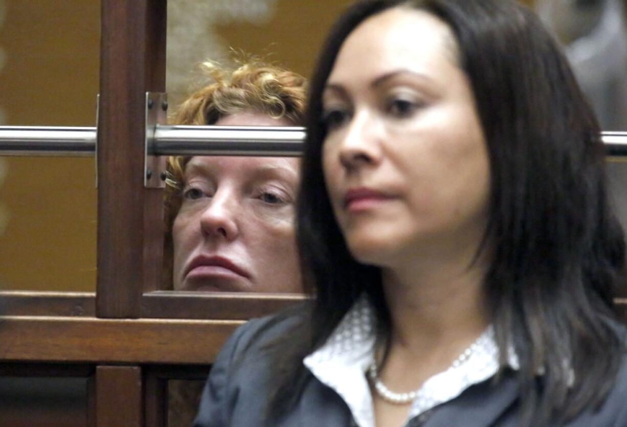 Tonya Couch, left, is seen during an extradition hearing at the Los Angeles Superior Court, in Los Angeles on Tuesday. Couch, mother of a fugitive teenager known for using an &quot;affluenza&quot; defense in a deadly drunken-driving case, waived extradition and will be sent to Texas to face a charge of hindering the apprehension of a felon.