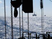 The satellite oil rig &quot;Danny Adkins,&quot; owned by Noble Oil, can be seen on the horizon from the Perdido platform in the Gulf of Mexico. An analysis shows that increasing U.S.