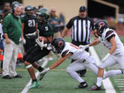 Evergreen player Dustin Nettles is tackled by Camas player Kade Anderson during a game at McKenzie Stadium in Vancouver Friday September 25, 2015.