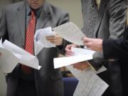 Clark County Commissioner Marc Boldt, left, and Jeff Hamm, executive director of C-Tran, look over election results at Gaiser Hall at Clark College Tuesday November 8, 2011 in Vancouver, Washington.