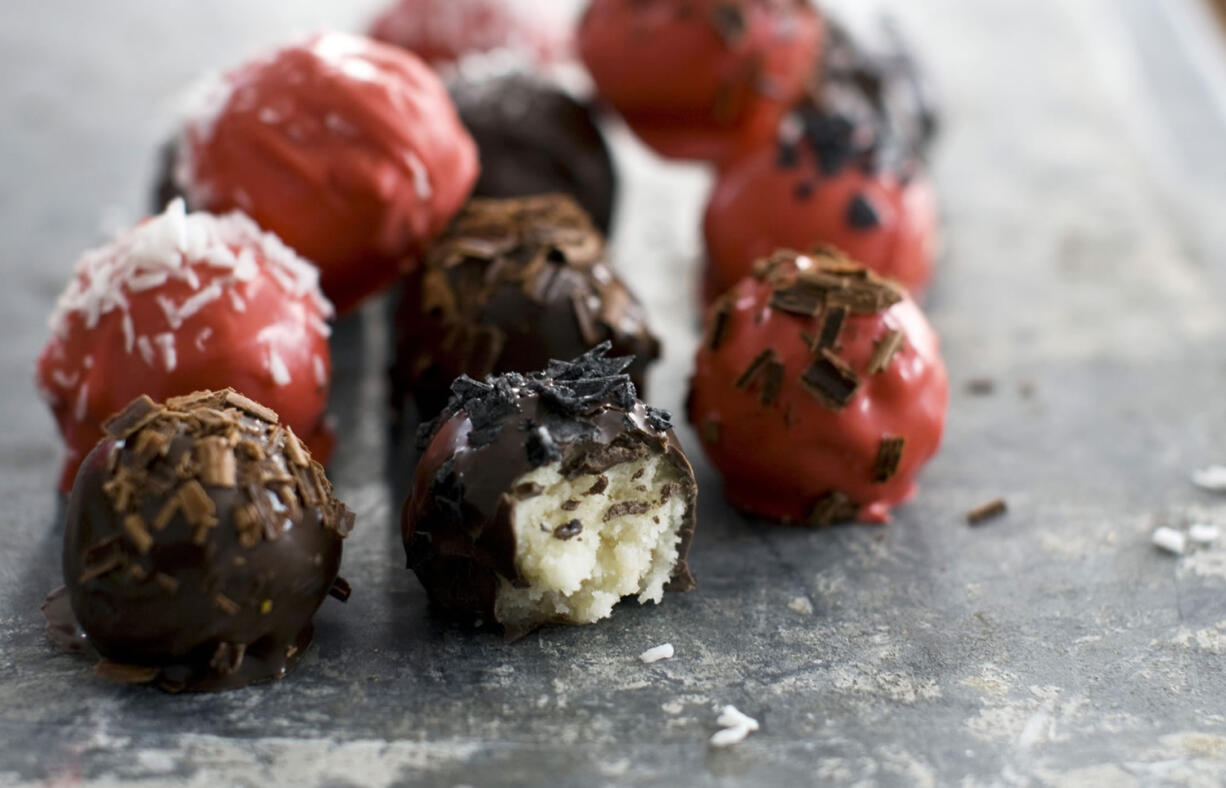 This Jan. 17, 2012 photo shows quince-filled chocolate marzipan bonbons in Concord, N.H. For a gourmet touch, these bonbons can be sprinkled with some flake sea salt, candy sprinkles, finely crushed nuts or coconut.