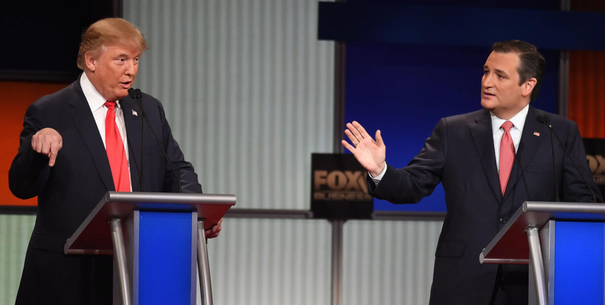 Republican presidential candidate businessman Donald Trump, left, debates with Republican presidential candidate Sen. Ted Cruz, R-Texas, Thursday during the Fox Business Network Republican presidential debate at the North Charleston Coliseum, in North Charleston, S.C.