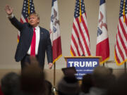 Republican presidential candidate Donald Trump waves after speaking to a campaign rally at Dordt College, on Saturday, Jan. 23, 2016, in Sioux Center, Iowa.