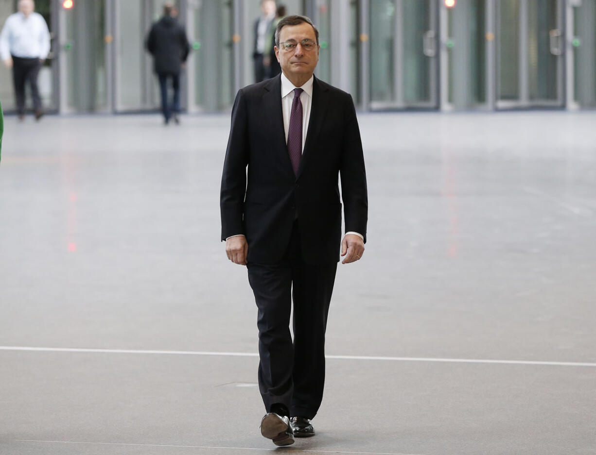 President of the European Central Bank Mario Draghi, walks in the lobby of the ECB headquarters two days ahead of a meeting of the governing council in Frankfurt, Germany, on Tuesday.