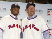 Former Seattle Mariners Ken Griffey Jr., left, and former New York Mets Mike Piazza pose for a photograph after a press conference announcing their election to baseball's Hall of Fame, Thursday, Jan. 7, 2016, in New York. Both men will be inducted into the Hall of Fame this summer.