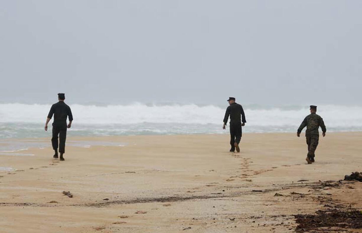 U.S. Marine Corps, Marines attached to Marine Heavy Helicopter Squadron 463 search Jan. 15 for debris of a helicopter mishap in Haliewa Beach Park, Hawaii. The status of the missing Marines changed to deceased on Wednesday after five days of searching for them. (Cpl. Ricky S. Gomez/U.S.