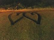 These hearts were in the snow outside a Camas home. The photographer (Julie Sellner) said that the hearts were caused by a car's tire tracks.