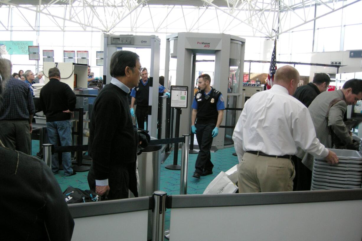 Holiday air travelers will go through new full-body scanners this year at Portland International Airport.