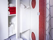 Ikea's Lillangen laundry hamper and tall-boy cabinet has portholes for laundry, perfect for a tight narrow space.