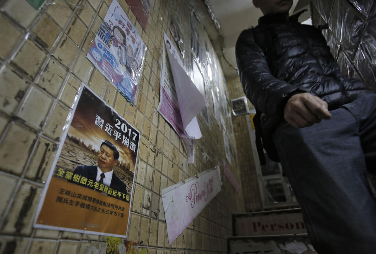 A man walks down the stairs of the closed Causeway Bay Bookstore which are known for gossipy titles about Chinese political scandals and other sensitive issues that are popular with visiting tourists from the mainland in Hong Kong on Sunday.