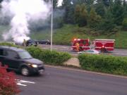 Vancouver firefighters tend to a burning SUV along Interstate 5 Sunday evening.