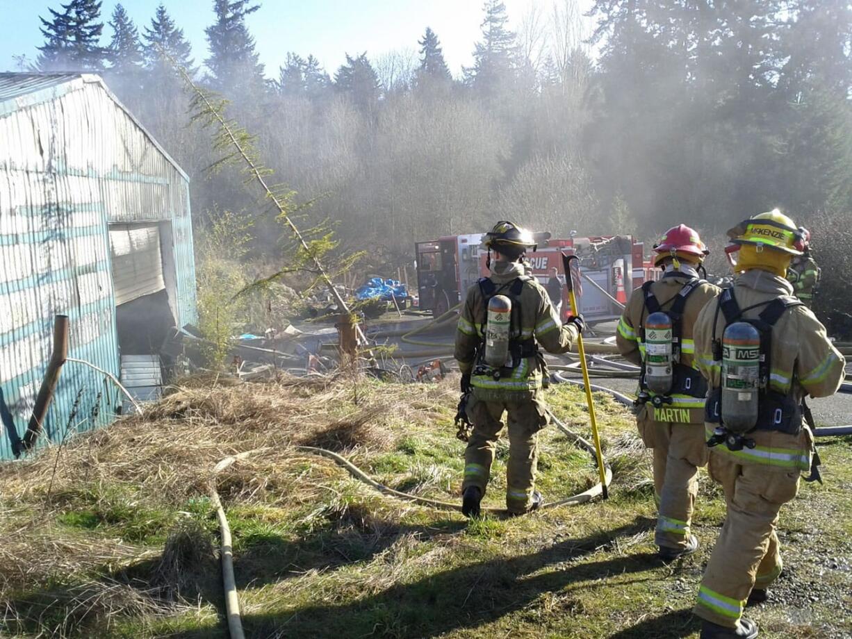 Firefighters with Clark County Fire &amp; Rescue and Clark County Fire District 6 on Monday morning doused a fire in an outbuilding near Ridgefield.