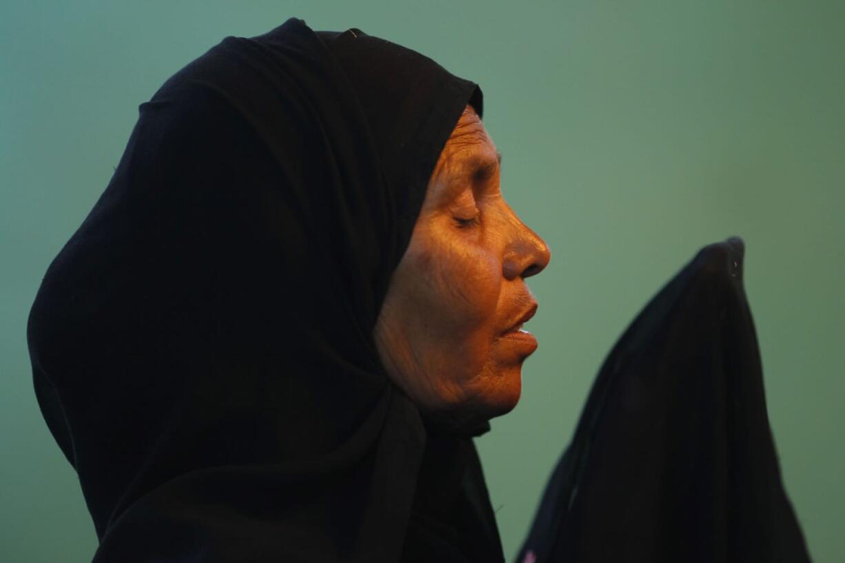 In this May 10, 2012 photo, Fatima Munshi prays at the shrine of a holy Muslim Sufi saint in Khandwa, India. She visited the shrine often in the 25 years before she was reunited with her lost son Saroo, praying for his return. Living in Australia, Saroo Brierley, 30, was reunited with his biological mother, Munshi, in February 2012, 25 years after an ill-fated train ride left him an orphan on the streets of Calcutta.