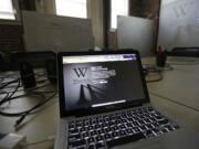 A blackout page is displayed on a computer screen Wednesday at the Wikipedia Foundation in San Francisco. Wikipedia was protesting pending U.S.