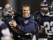 Head football coach Steve Kizer of Skyview High School celebrates a defensive touchdown against Kentwood High School during the second half Friday November 11, 2011 in Vancouver, Washington. Skyview beat Kentwood 34-7.