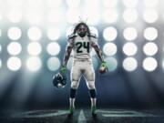 Running back Marshawn Lynch poses in one of the Seahawks' new uniforms.