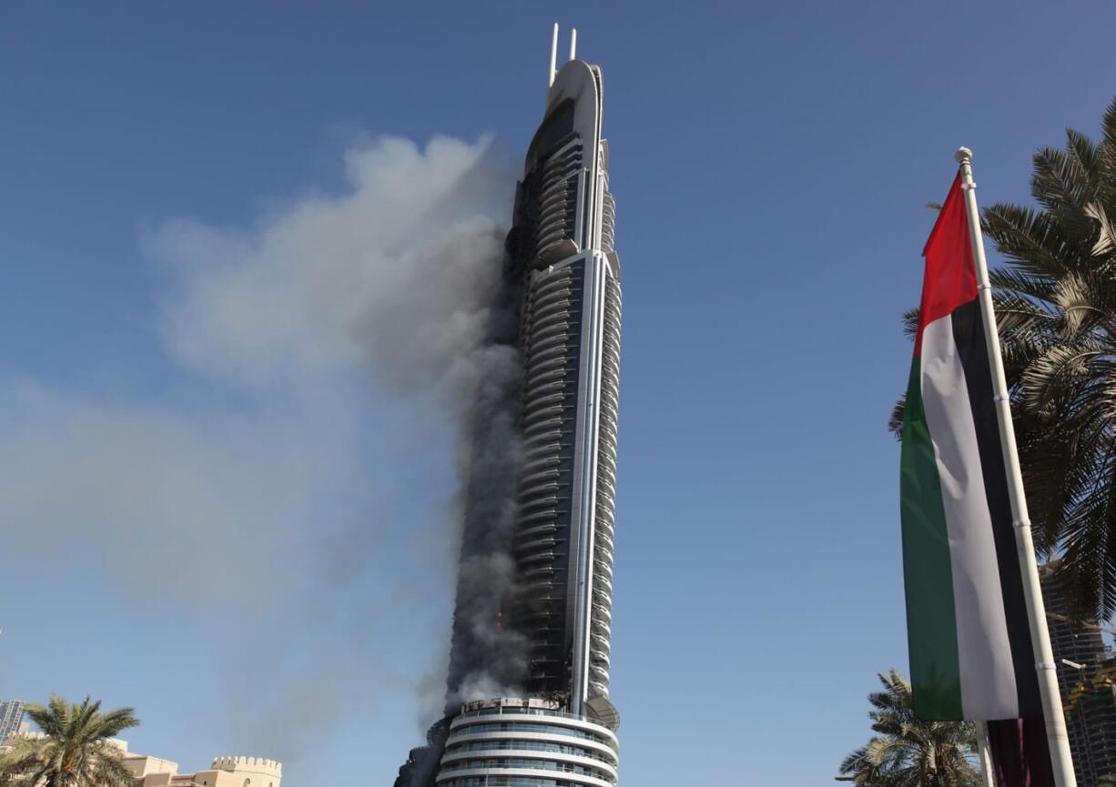 Smoke billows from the Address Downtown skyscraper in Dubai, United Arab Emirates on Friday. The blaze began Thursday night before Dubai&#039;s annual New Year&#039;s Eve fireworks show at the Burj Khalifa, the world&#039;s tallest building which sits nearby.