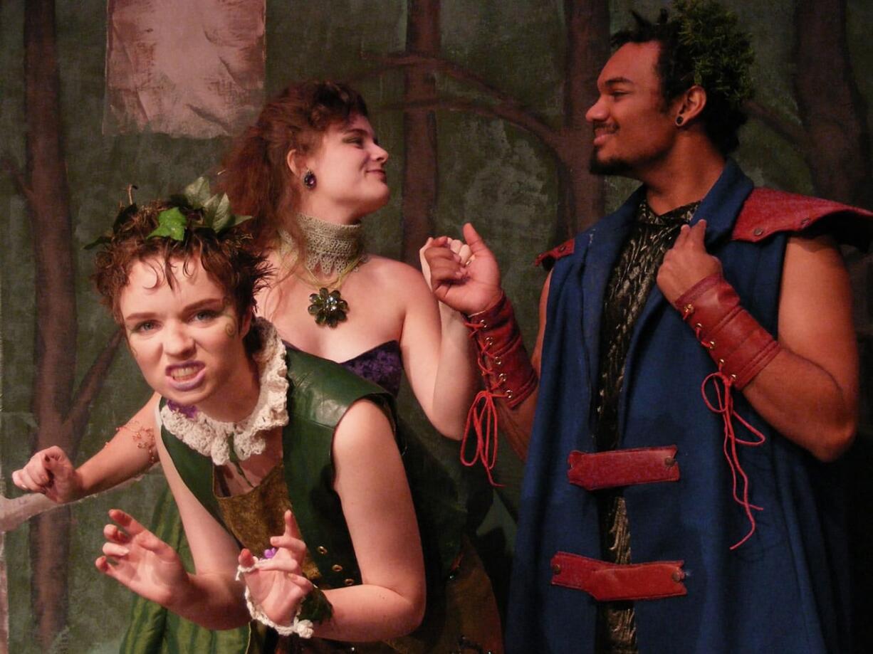 Rose Caughie plays Puck the Hobgoblin,  left, Amanda Hoffmann is Titania, and Anthony Taylor is Oberon in &quot;A Midsummer Night's Dream,&quot; a production by at Prairie and Battle Ground high schools.