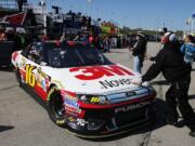 Greg Biffle (16) pulls out of the garage during practice for the NASCAR Sprint Cup Series auto race at Kansas Speedway in Kansas City, Kan., on Friday.