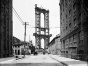 The superstructure from the Manhattan Bridge rises above Washington Street in New York on June 5, 1908.