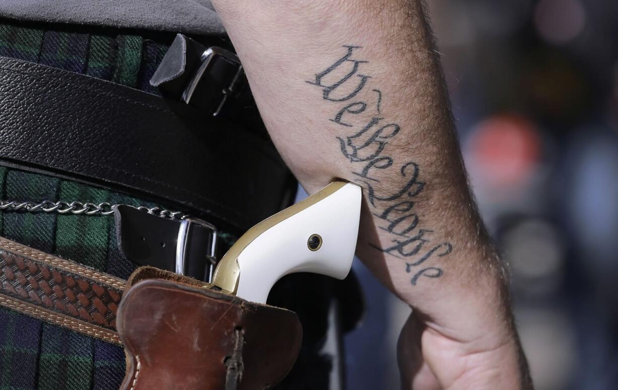 AScott Smith, a supporter of open carry gun laws, wears a pistol as he prepares for a rally in support of open carry gun laws at the Capitol, in Austin, Texas. Texas the second-most populous state, is joining 44 other states in allowing at least some firearm owners to carry handguns openly in public places. Under the Texas law, guns can be carried by those with licenses and only in holsters.