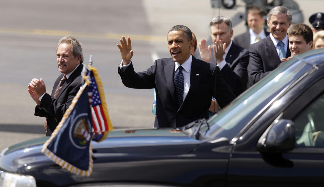 Ed Cote of Vancouver, left, stands near President Barack Obama shortly after Air Force One touched down Thursday at Boeing Field in Seattle.