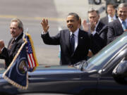 Ed Cote of Vancouver, left, stands near President Barack Obama shortly after Air Force One touched down Thursday at Boeing Field in Seattle.