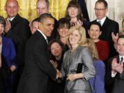 President Barack Obama congratulates Rebecca Mieliwocki, the 2012 National Teacher of the Year, Tuesday  at the White House.