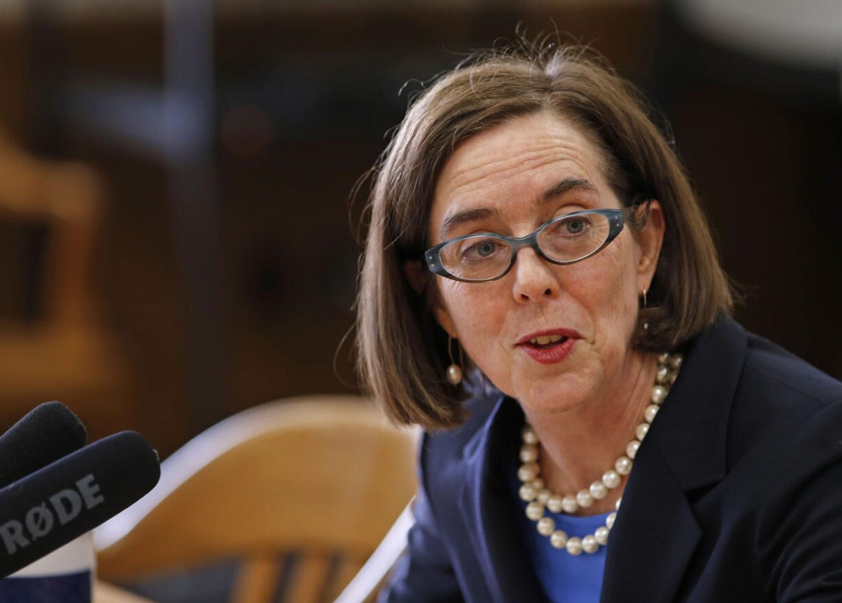 Oregon Sen. Doug Whitsett, R-Klamath Falls, clockwise from top left, Oregon Gov. Kate Brown and Senate Majority Leader Ginny Burdick, D-Portland, talk about 2016 legislative session priorities Tuesday at the Oregon State Capitol in Salem, Ore. (Photos by Timothy J.