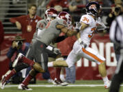 Oregon State's Jordan Jenkins (34) runs for a touchdown ahead of Washington State's Tyree Toomer, center, and Daniel Simmons (24) in the first half Saturday.