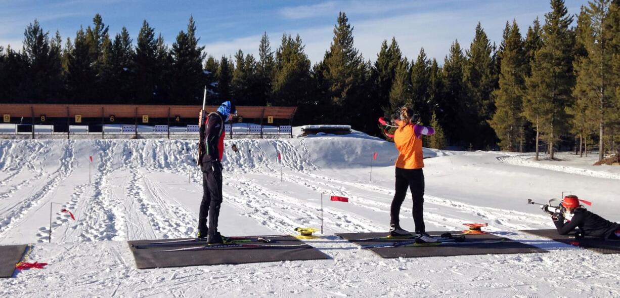 Biathlon racers practice at the West Yellowstone Rendezvous Ski Trails center in Montana. Biathlon requires the skills of cross country skiing with an 8-pound rifle strapped to the skier&#039;s back and the discipline to calm everything down in an instant to fire off five shots between skiing laps.