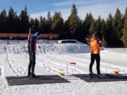 Biathlon racers practice at the West Yellowstone Rendezvous Ski Trails center in Montana. Biathlon requires the skills of cross country skiing with an 8-pound rifle strapped to the skier&#039;s back and the discipline to calm everything down in an instant to fire off five shots between skiing laps.