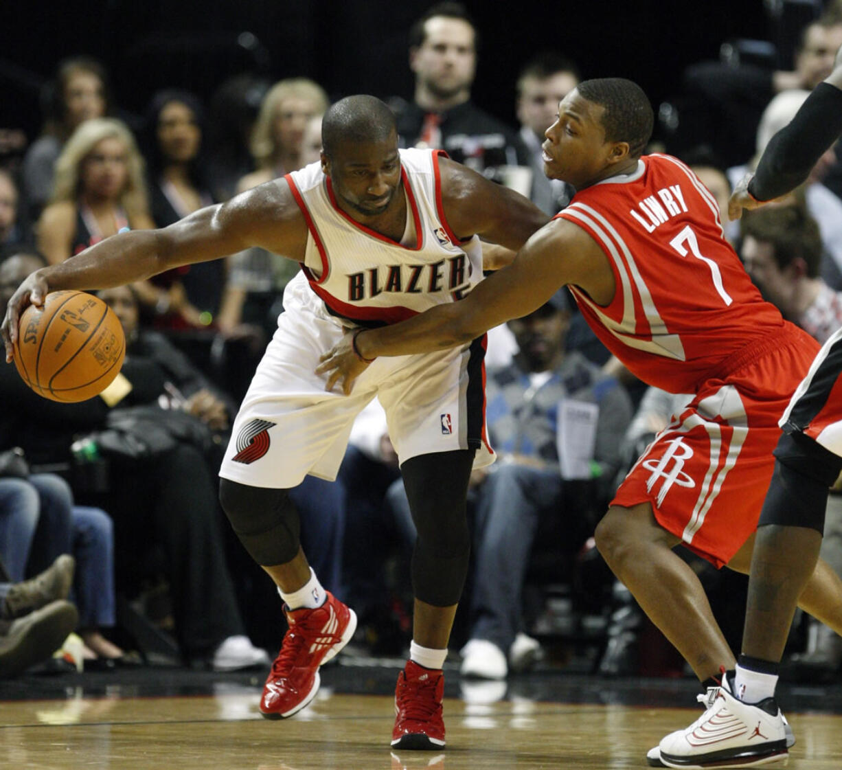 Portland Trail Blazers' Raymond Felton (5) drives against Houston Rockets' Kyle Lowry (7) during second quarter Wednesday.