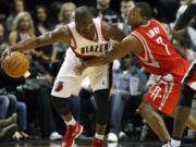 Portland Trail Blazers' Raymond Felton (5) drives against Houston Rockets' Kyle Lowry (7) during second quarter Wednesday.