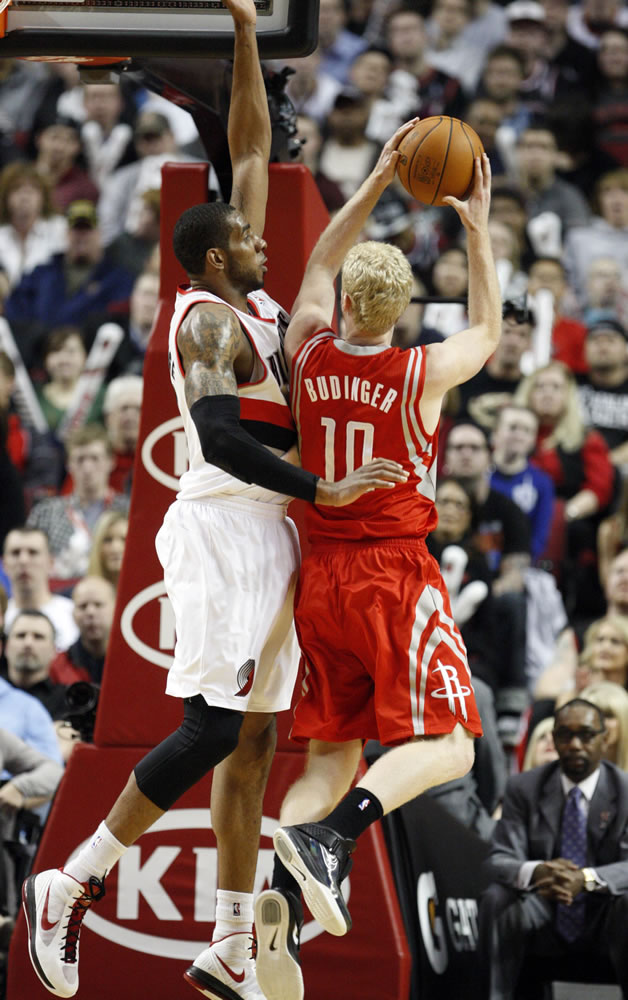 Portland's LaMarcus Aldridge, left, defends against Houston's Chase Budinger (10).