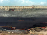 Conveyor belts and heavy equipment remove coal from the Wyodak Resources mine in northeastern Wyoming for delivery to a nearby Black Hills Power coal plant complex in Wyodak, Wyo., in 2010.
