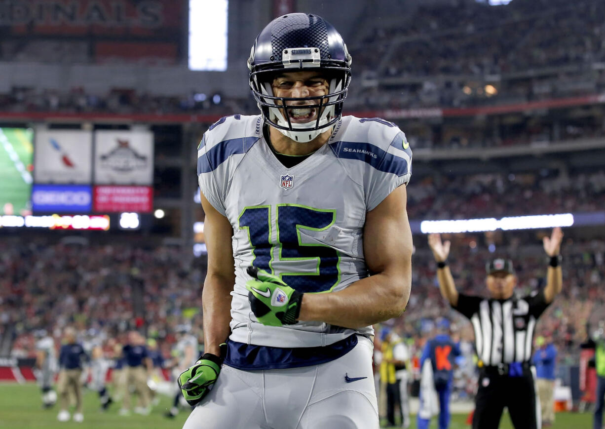 Seattle Seahawks wide receiver Jermaine Kearse (15) celebrates his touchdown against the Arizona Cardinals during the first half of an NFL football game, Sunday, Jan. 3, 2016, in Glendale, Ariz. (AP Photo/Ross D.