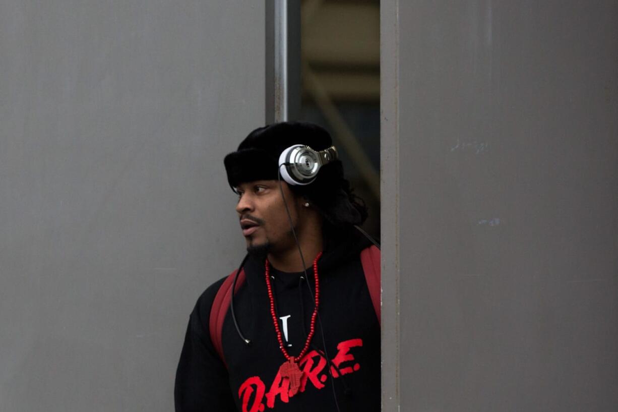 Marshawn Lynch leaves the team training center to board a bus to the airport for Sunday&#039;s game in Carolina.