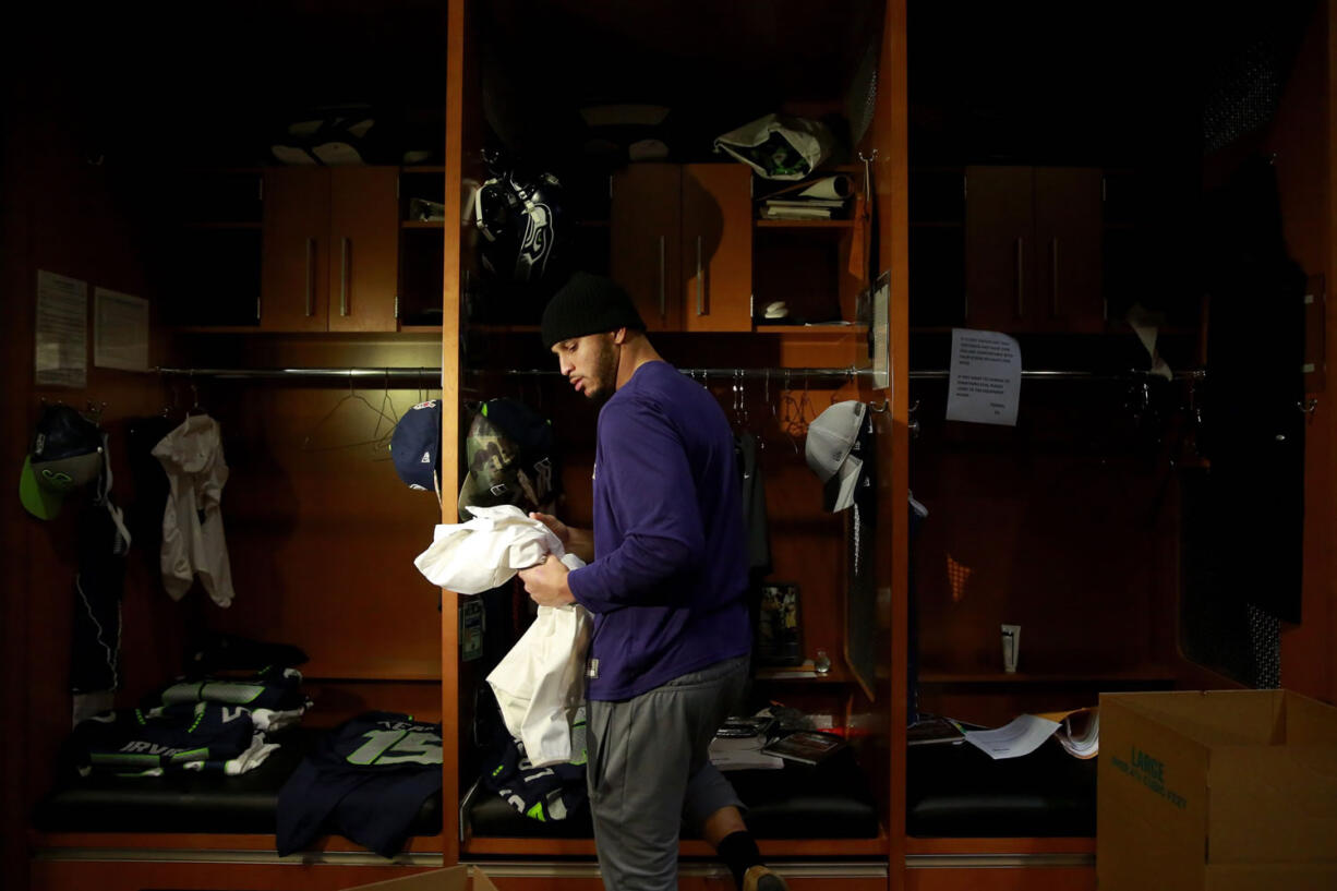 Jermaine Kearse cleans out his locker inside the Seattle Seahawks locker room Monday in Renton. Whether the Seahawks re-sign Kearse, who is a free agent, is one of several offseason decisions the franchise must face.