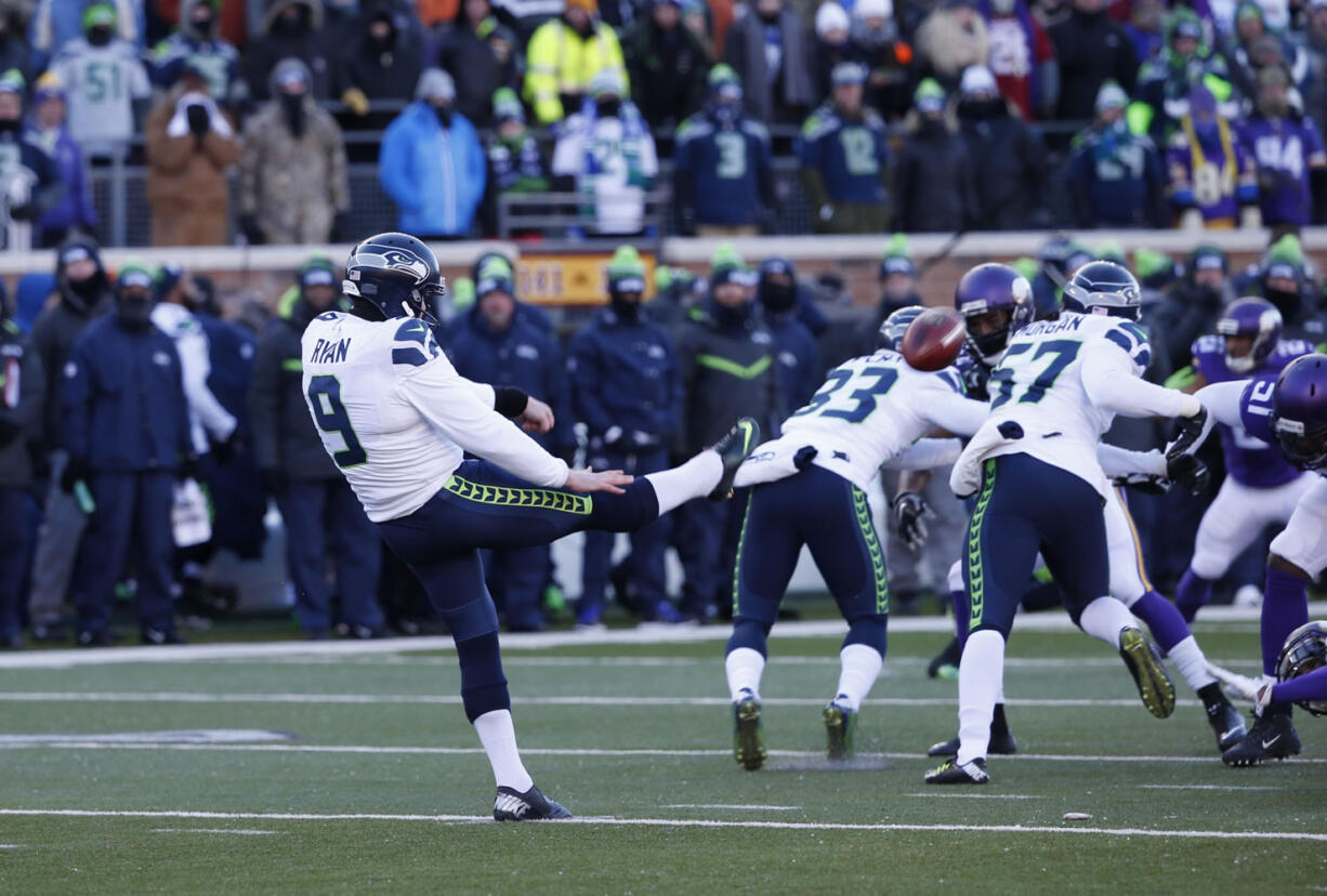 Seattle Seahawks punter Jon Ryan (9) punts during the first half of an NFL wild-card football game against the Minnesota Vikings, Sunday, Jan. 10, 2016, in Minneapolis.