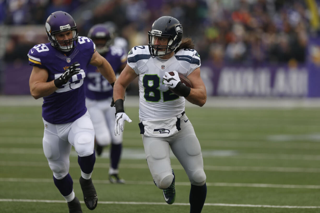 Seattle Seahawks tight end Luke Willson (82) runs with the ball against the Minnesota Vikings in the first half of an NFL football game Sunday, Dec. 6, 2015 in Minneapolis.