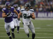 Seattle Seahawks tight end Luke Willson (82) runs with the ball against the Minnesota Vikings in the first half of an NFL football game Sunday, Dec. 6, 2015 in Minneapolis.