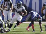 Seattle Seahawks' Marshawn Lynch (24) had 12 carries for 98 yards and a touchdown Sunday against the New York Giants.