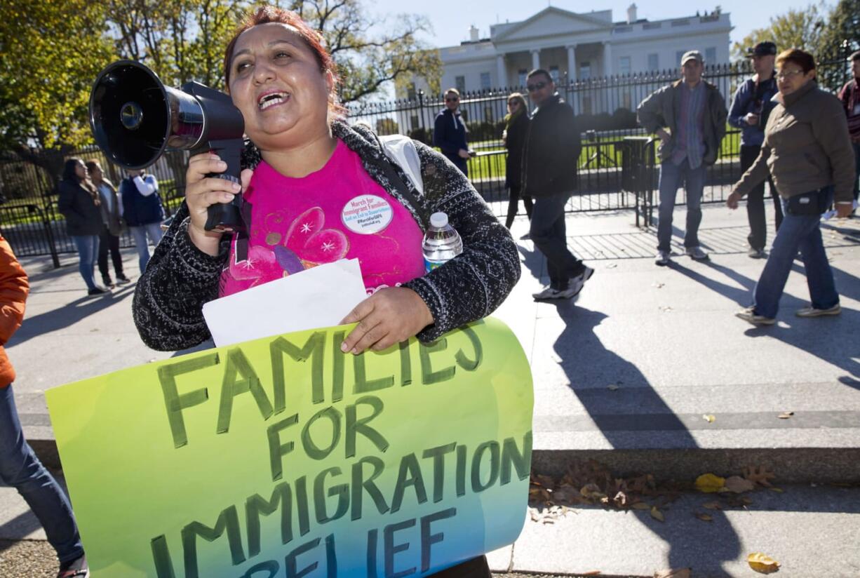 Ingrid Vaca, originally of Bolivia, speaks during rally for immigration reform in front of the White House in Washington. The Supreme Court has agreed to an election-year review of President Barack Obama&#039;s executive orders to allow up to 5 million immigrants to ?come out of the shadows? and work legally in the U.S.