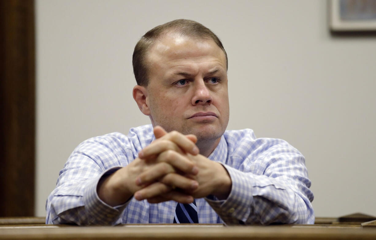 Tim Eyman looks on from the gallery during a hearing on the legality of his latest anti-tax measure in King County Superior Court in January in Seattle.