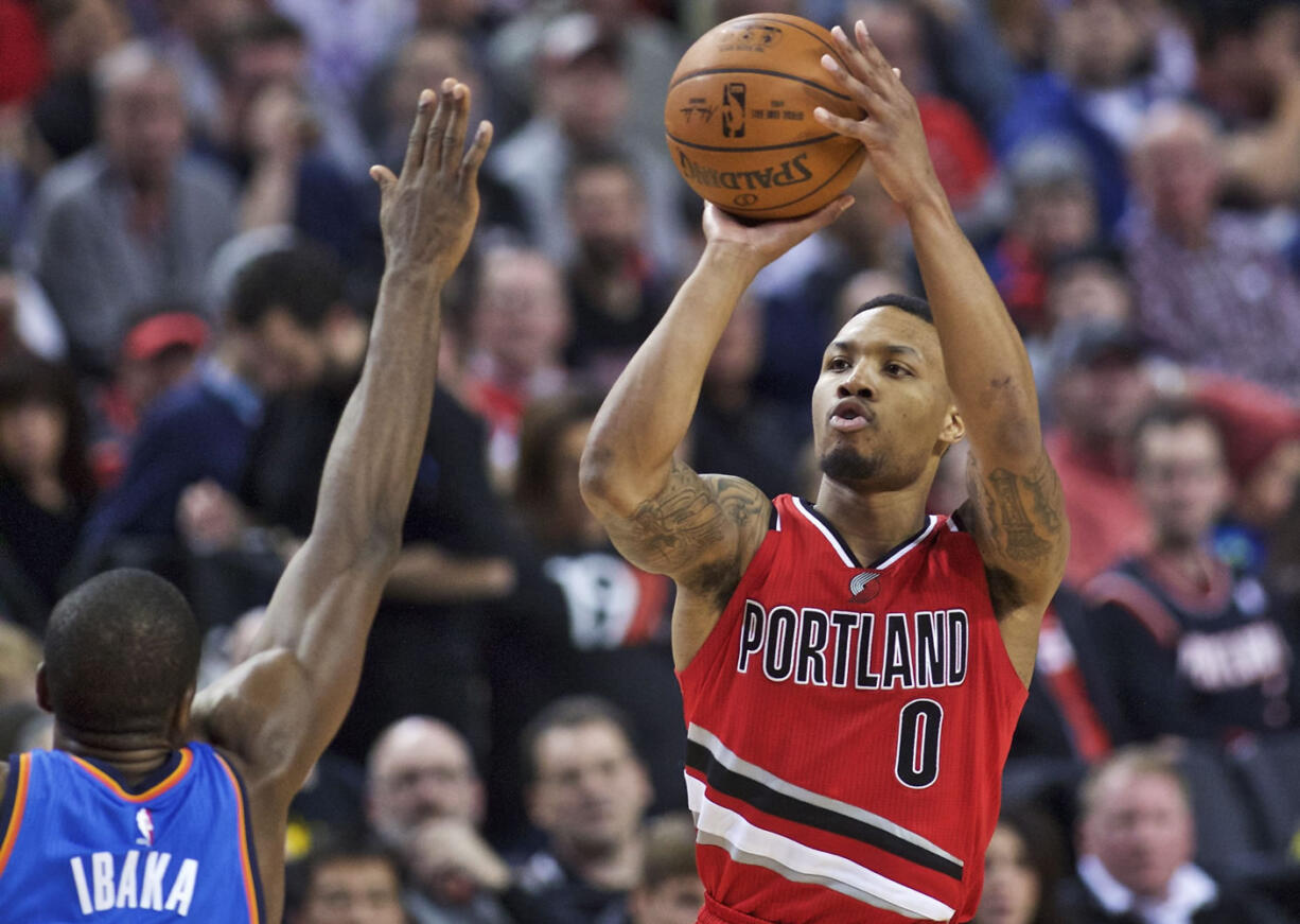 Damian Lillard shoots over Oklahoma City&#039;s Serge Ibaka.