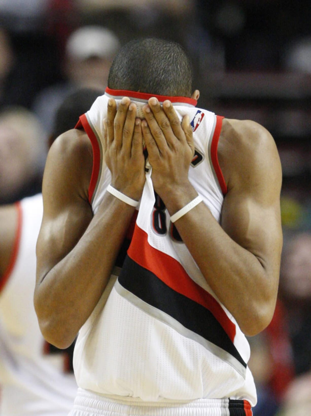 Portland Trail Blazers' Nicolas Batum wipes his face in the second half during an NBA basketball game with the Oklahoma City Thunder Tuesday, March 27, 2012, in Portland, Ore. The Thunder defeated the Trail Blazers 109-95.