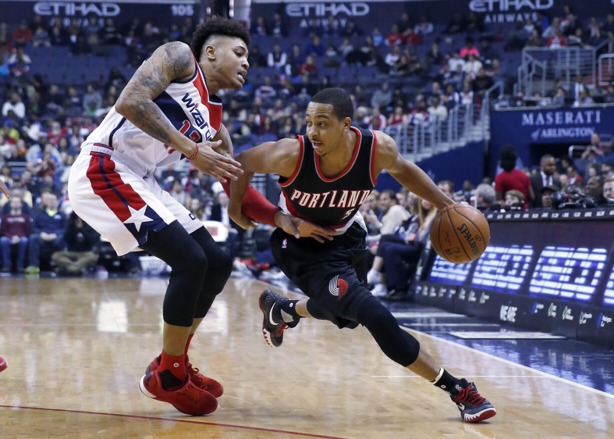 Portland guard C.J. McCollum drives to the hoop on against Washington.